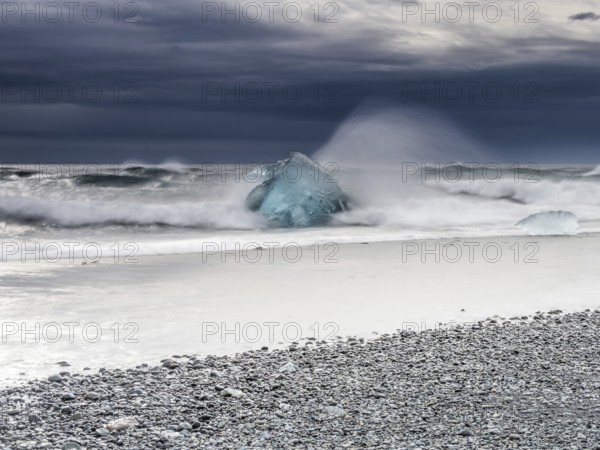 Diamond Beach, iceberg in the surf, near Jökulsarlon glacier lagoon, Vatnajökull National Park,