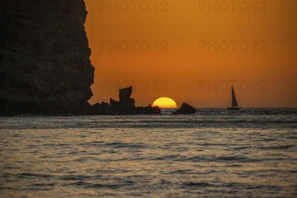 Sunrise during a sandstorm, Calima. The haze-covered horizon turns orange as the sun rises as a