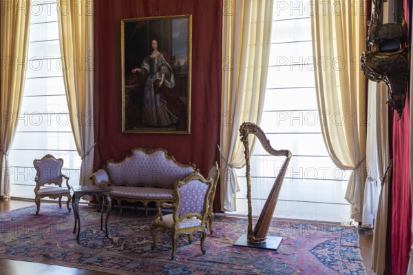 Venaria Reale, Italy, February 2023: luxury interior, old Royal Palace. Perspective with harp,
