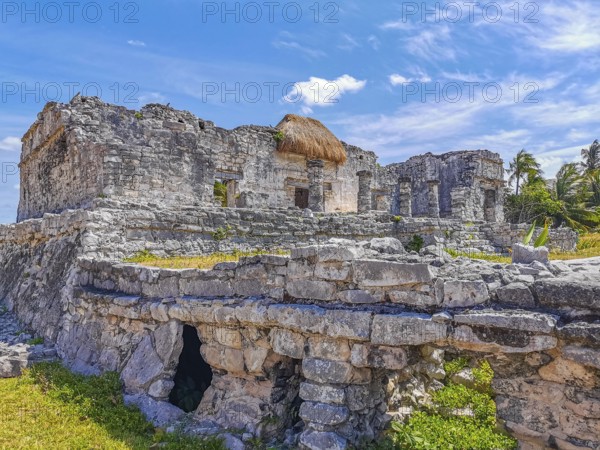 Ancient Tulum ruins Mayan site with temple ruins pyramids and artifacts in the tropical natural