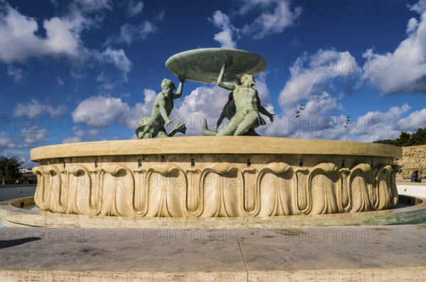 The famous Triton fountain, three bronze Tritons holding up a huge basin, in front of the City Gate