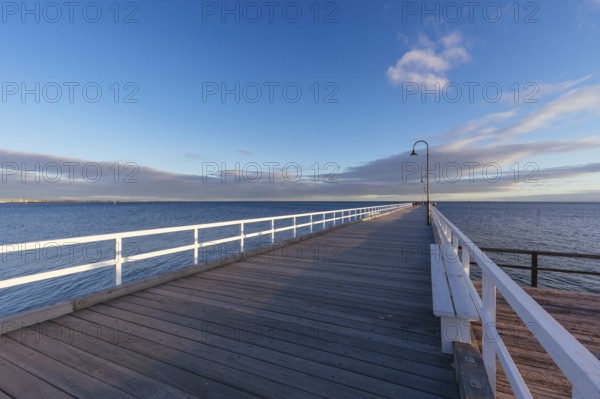 Kerford Rd Pier and Albert Park Yachting Angling Club in Albert Park at sunset on a winter's