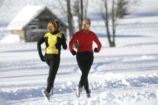 Running in the snow, man, 35, 40, years, running, running, snow, winter, two woman