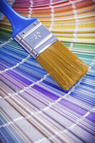 Single paint brush on color palette