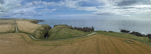 Slains Castle, castle ruins on the cliffs, drone shot, Cruden Bay, Peterhead, Aberdeenshire,