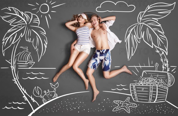 Happy Valentines love story concept of a romantic couple on a desert island, sharing headphones,