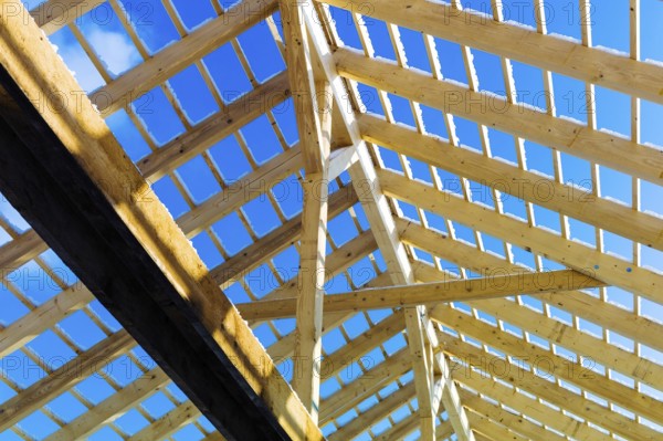 Roof construction made of wood, symbolic photo for home ownership, house construction and house