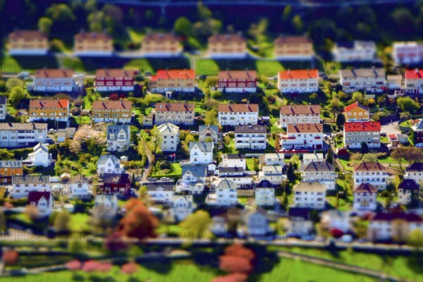 Tilt-shift creative image of an upper-class residential city suburb district with houses and
