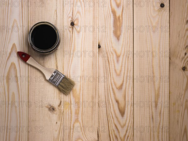Stain and brush on wooden backdrop