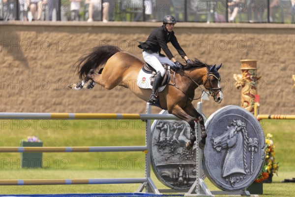 Vaclav Stanek from Czechoslovakia, and riding Quintin, compete in the 1.60m Grand Prix during The