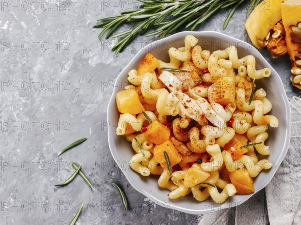 Fusilli pasta with pumpkin, rosemary and brie cheese. Idea recipe pasta. Vegetarian food. Homemade