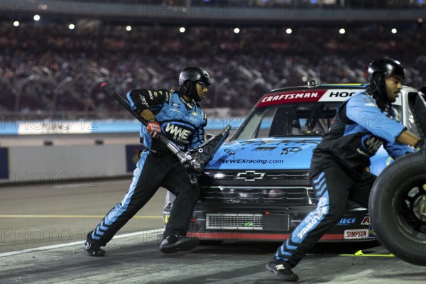 The crew of Niece Motorsports work on the car prior to performs a pit stop on pit road during the