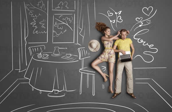 Love story concept of a romantic couple against chalk drawings background. Male listening to music
