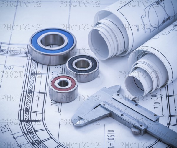 Close up image of construction drawings slide caliper rolling bearings on blueprint architecture