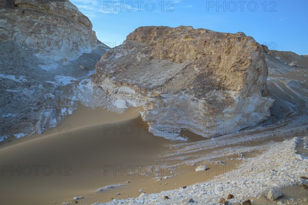Late afternoon sun casting shadows on rocks in the Libyan desert white desert, Farafra, Egypt,