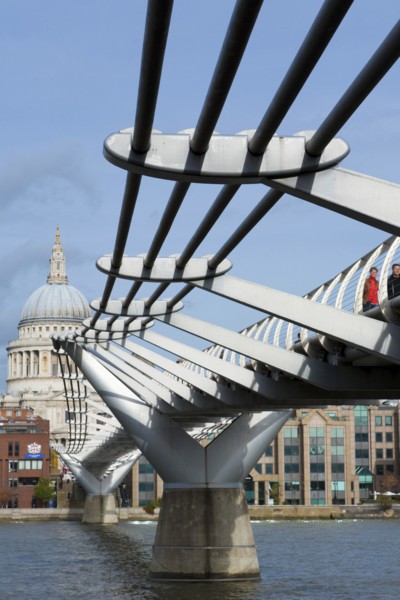 Pedestrians crossing Millennium Bridge over the River Thames, St. Paul's Cathedral, London,