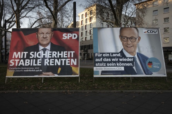 Election posters of the candidates for chancellor Olaf Scholz (SPD, left) and Friedrich Merz (CDU,
