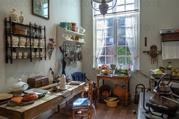 Kitchen inside 18th century clergy house, parsonage, rectory Schriek at recreated village in open