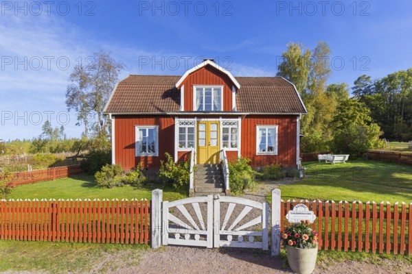 Katthult, red wooden farm house with fence from Astrid Lindgren's tales about Emil of Lönneberga at