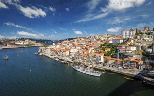 Aerial view of Porto city and Douro river with moored sailling ship from Dom Luis bridge I. Porto,