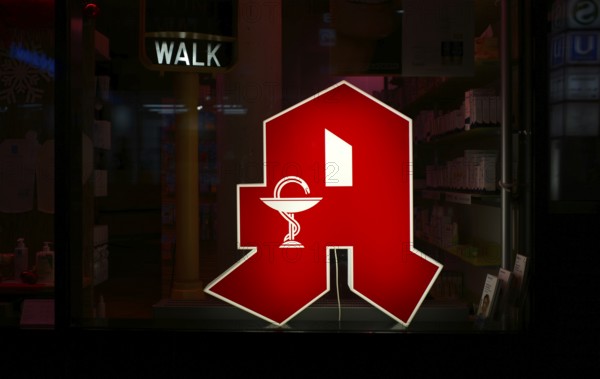 Night shot, logo, red neon sign, sign, pharmacy with Aesculapian staff, Aesculapian staff,