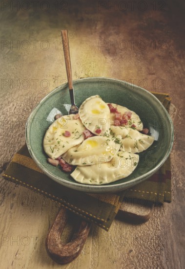 Dumplings, with fried prosciutto, a traditional dish of Polish cuisine, dumplings, top view,