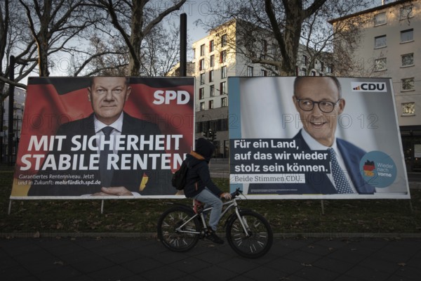 Election posters of the candidates for chancellor Olaf Scholz (SPD, left) and Friedrich Merz (CDU,