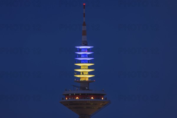 The Europe Tower in Frankfurt am Main shines in the Ukrainian national colours yellow and blue on