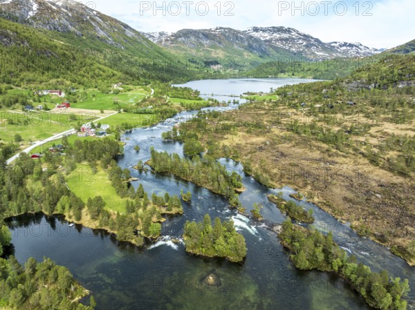 Gaularfjell mountain crossing following river Gaula and chain of lakes, early spring, aerial view,