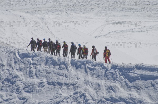 Rope team on the glacier of Mont Blanc (4805 m) . in the Savoy Alps, in the department of
