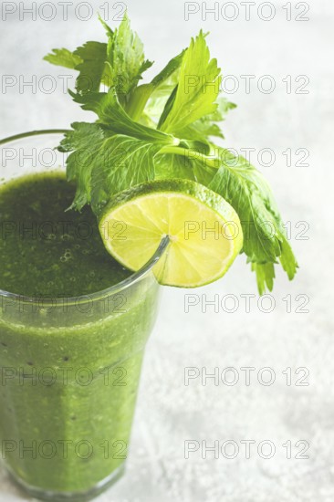 Glass with green smoothie, celery and spinach, apple and kiwi, cucumber, vegetable smoothie,