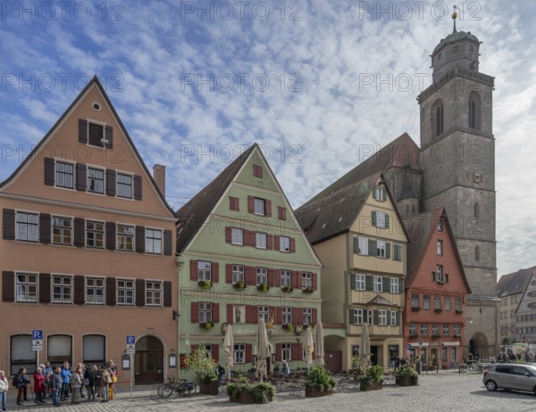 Historic residential and commercial buildings, on the right the late Gothic hall church of St