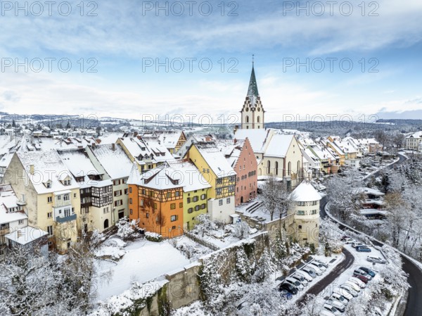 Aerial view of the snow-covered town of Engen in Hegau on a winter morning with the Church of the