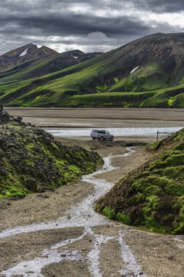 Off-road vehicle in volcanic landscape, Moss-covered mountains, Rhyolite mountains, Volcanic
