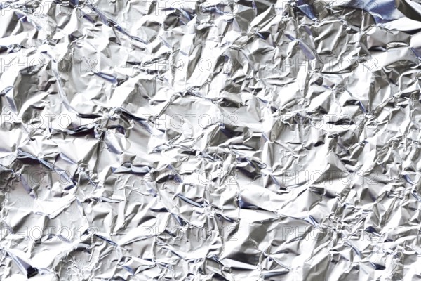 Crumpled white aluminium foil background