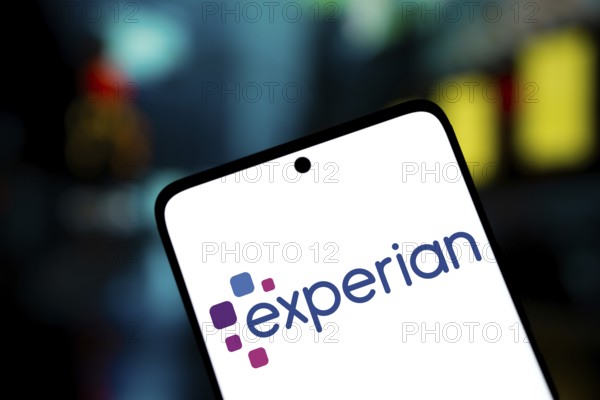 experian logo is displayed on smartphone. Experian plc is a multinational data analytics and