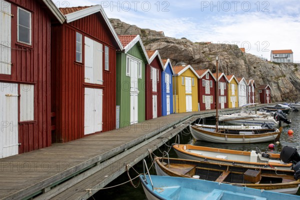 Small colourful houses by the sea. Typical houses in Sweden for the coastal landscape. Crab fishing