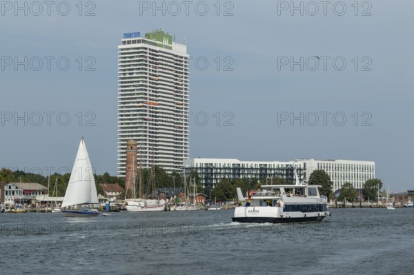 View from the Priwall onto the river Trave with the excursion ship Hansa and the Hotel Maritim,