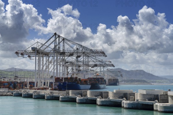 Tangier, Morocco, 1 April, 2024: container ships being unloaded and loaded at Tanger Med port in