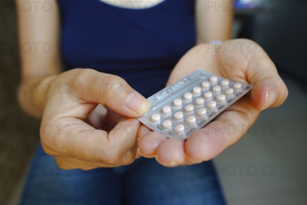 March 16, 2024, Brazil. A woman holds her birth control pill. The medication is a pill that