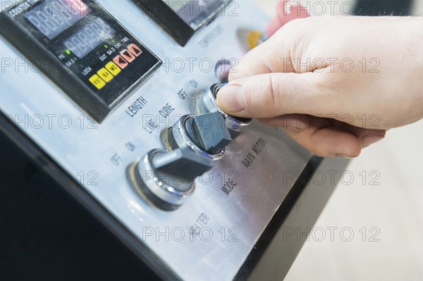 A close-up of the real male carpenter's not well-groomed hands completes the finish of the