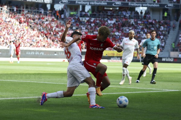 From left in a duel against #42# and Lucas Martinez Quarta during the football test match: SC