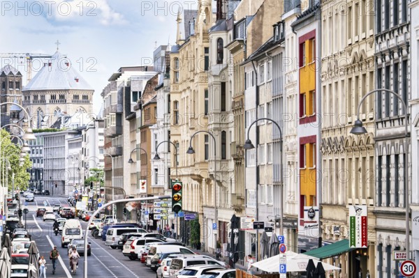House facades from the end of the 19th century in the Belgian Quarter and the medieval church of St