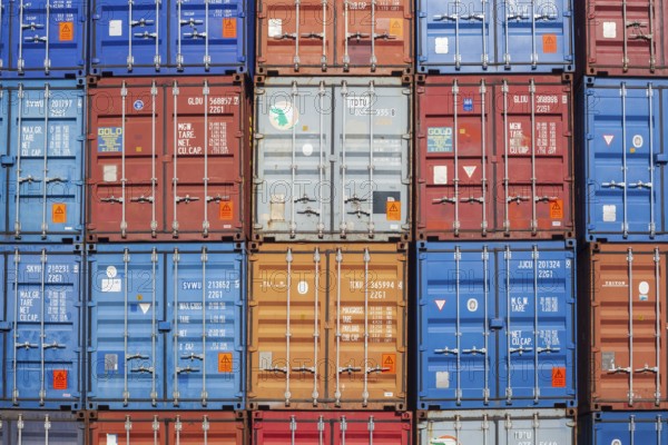 Stacked colourful freight containers at the container terminal in Holz-und Fabrikenhafen, Bremen,