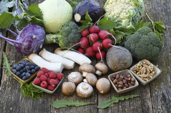 Healthy food, berries, cabbage, radishes, king oyster mushrooms, raspberries, nuts, blueberries,