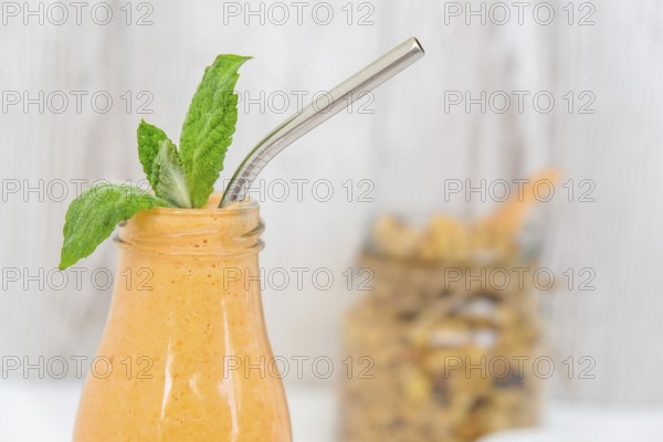 Seasonal pumpkin carrot smoothie drink detox with eco metal drinking straw Glass jar granola muesli