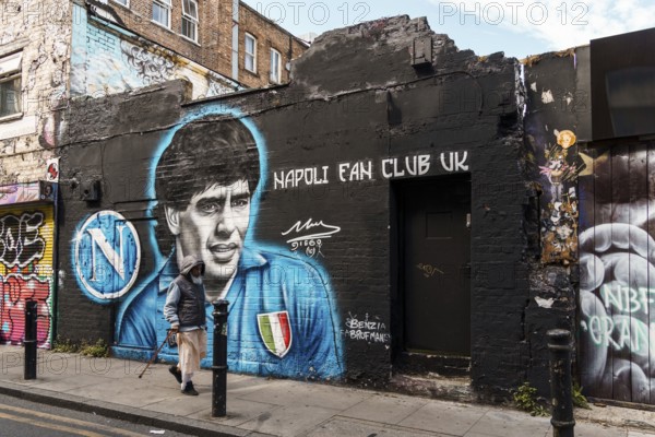London, UK, August 25, 2023: Street scene with people walking by Brick Lane in Shoreditch Area in