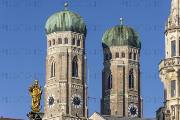 Towers of the Church of Our Lady and the golden statue of the Marian Column on Marienplatz, Munich,