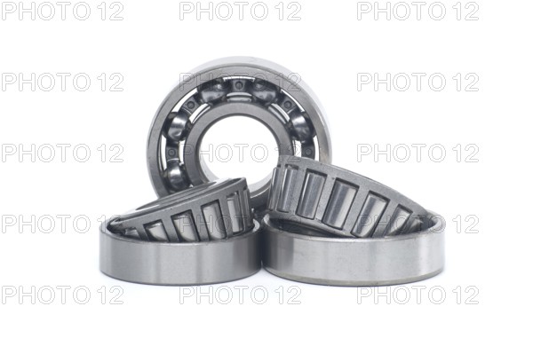 Single row tapered roller bearings and deep groove ball bearing without seal isolated on white