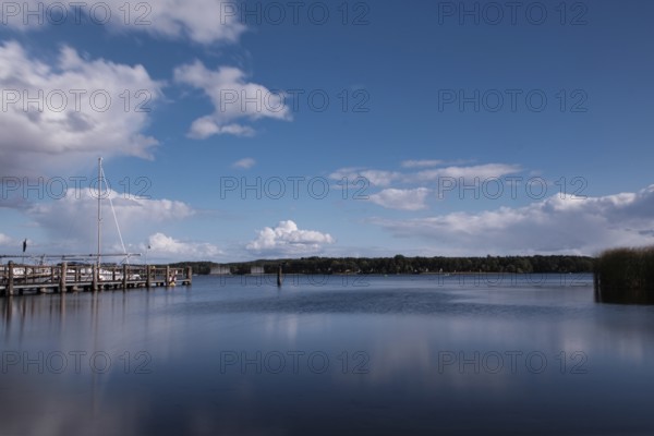 View over the Scharmützelsee with jetty and marina, long exposure, Wendisch-Rietz, Brandenburg,